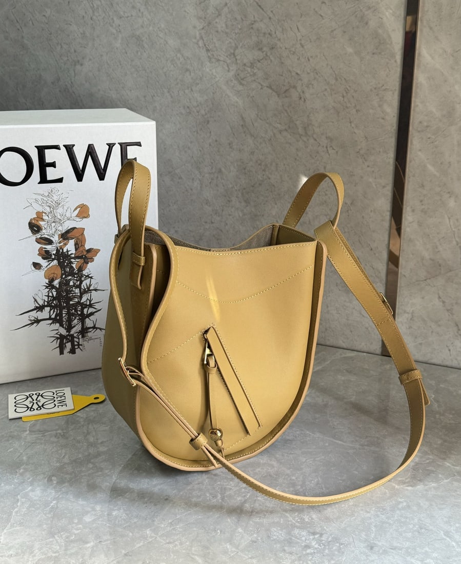 LOEWE: We offer FREE SHIPPING for both domestic and international clients who bid over $500. LOEWE's Hammock bag, the "Transformer" of the fashion world, is a new style I highly recommend!!! It's versatile