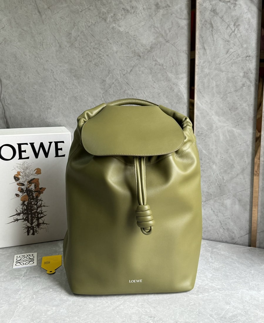 LOEWE: We offer FREE SHIPPING for both domestic and international clients who bid over $500. This LOEWE backpack features a streamlined, practical everyday design, paying homage to the iconic knotted detail