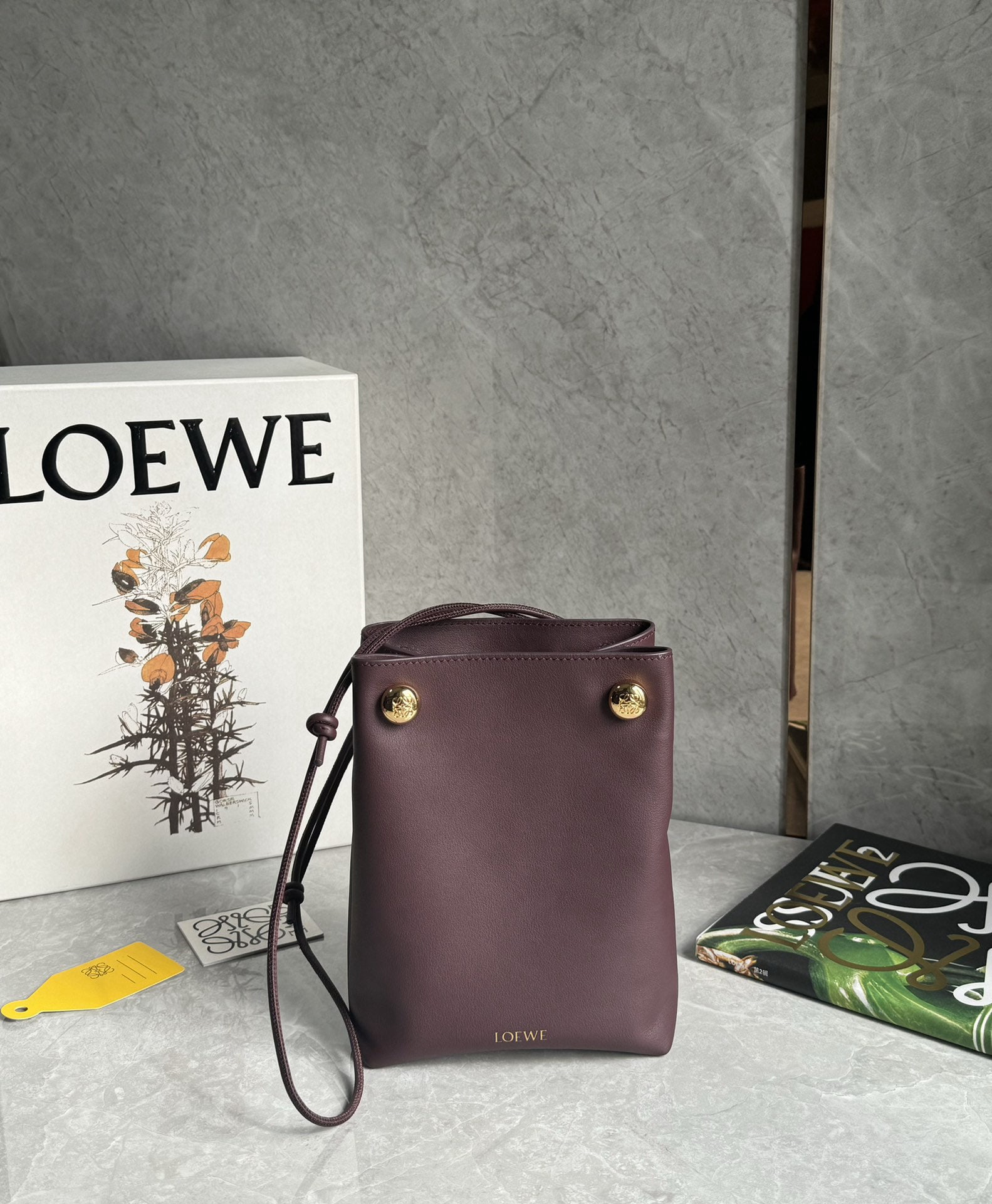 LOEWE: We offer FREE SHIPPING for both domestic and international clients who bid over $500. LOEWE Pebble Pouch: Small in size but surprisingly spacious, this bag can be worn under the arm or crossbody!