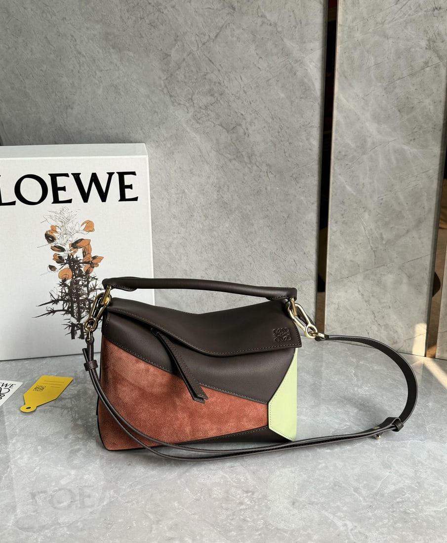LOEWE: We offer FREE SHIPPING for both domestic and international clients who bid over $500. LOEWE Suede Color-Blocked Puzzle Bag: This small, multi-colored version is crafted from classic cowhide leather