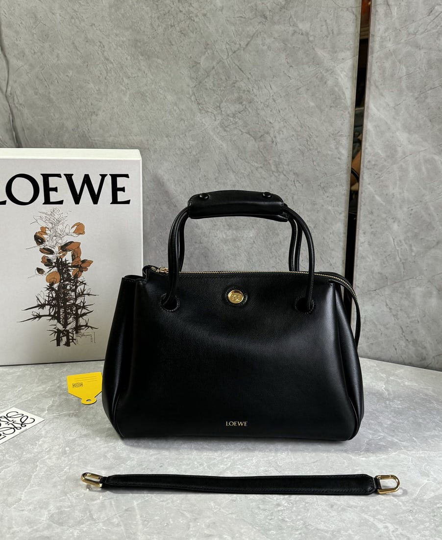 LOEWE: We offer FREE SHIPPING for both domestic and international clients who bid over $500. The LOEWE Madrid Medium bag features a soft, structured trapezoidal shape with a gusseted design, adjustable handl