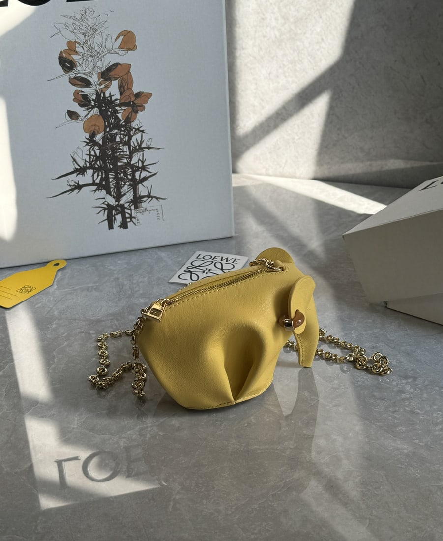 LOEWE: We offer FREE SHIPPING for both domestic and international clients who bid over $500. The LOEWE elephant bag is adorable, made entirely of leather inside and out, and has a large capacity to hold