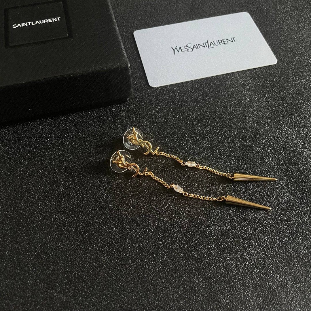 Yves Saint Laurent earrings: We offer FREE SHIPPING for both domestic and international clients who bid over $500. Yves Saint Laurent earrings exude independent elegance, charm, intellect, retro luxury, and understated sophistica
