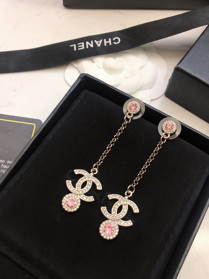 Chanel light gold rhinestone double C tassel earrings: We offer FREE SHIPPING for both domestic and international clients who bid over $500. Chanel light gold rhinestone double C tassel earrings with a fairy-like pink diamond pendant are absolutely gorgeo
