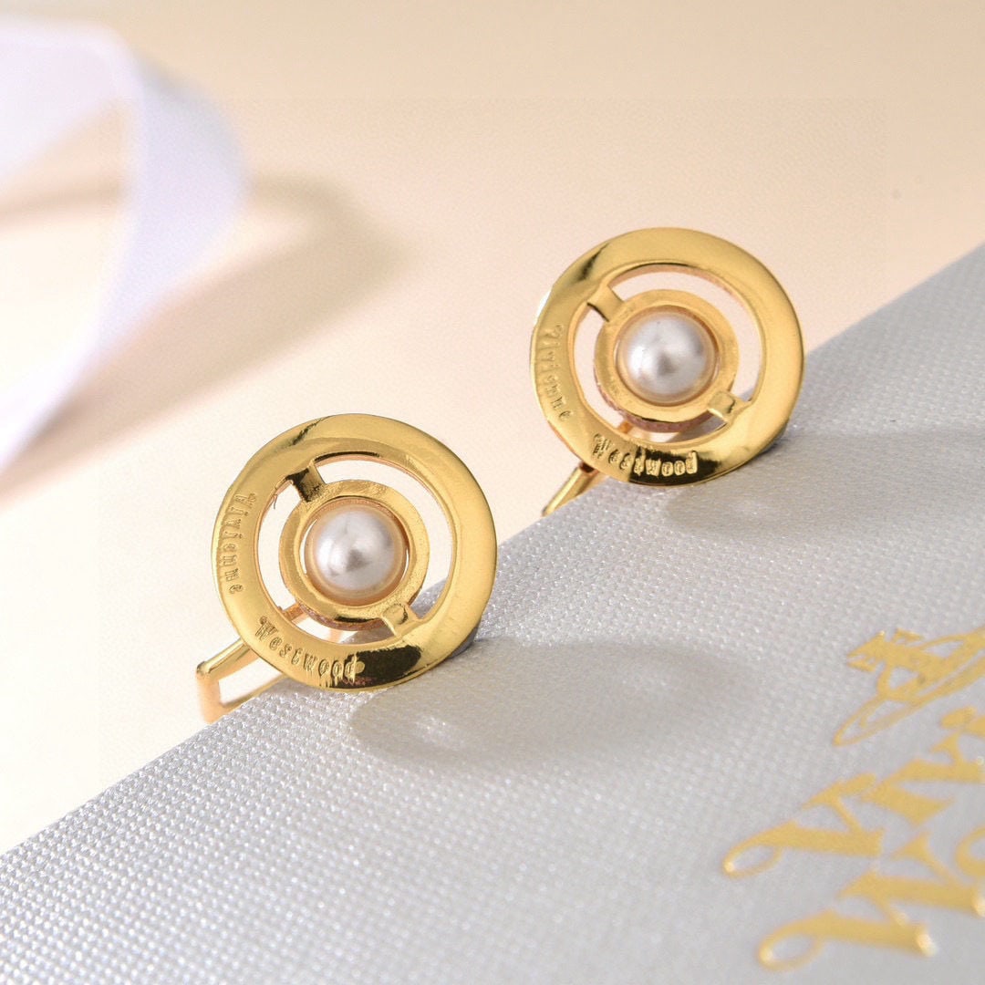 Vivienne Westwood: We offer FREE SHIPPING for both domestic and international clients who bid over $500. Vivienne Westwood Saturn earrings feature an elegant and sophisticated design that flatters the face shape,