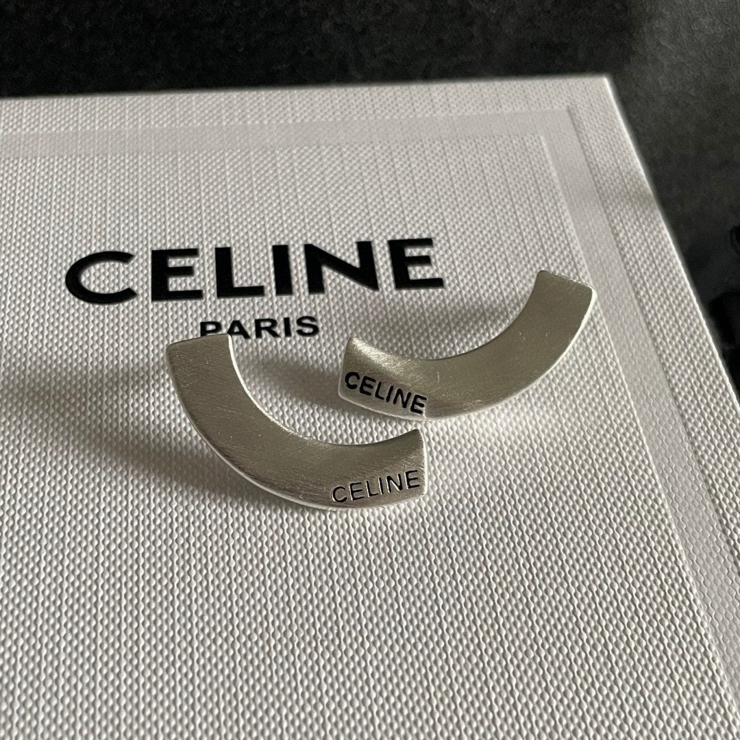Celine earrings: We offer FREE SHIPPING for both domestic and international clients who bid over $500. Celine earrings have always been a benchmark in minimalist fashion. Their bold designs are timeless and versatile,