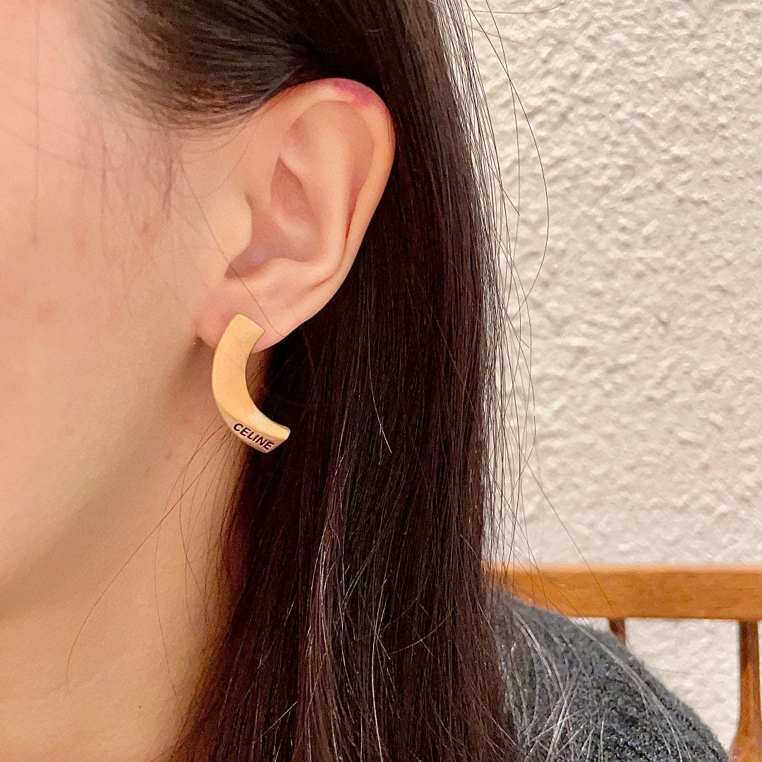 Celine earrings: We offer FREE SHIPPING for both domestic and international clients who bid over $500. Celine earrings have always been a benchmark in minimalist fashion. Their bold designs are timeless and versatile,