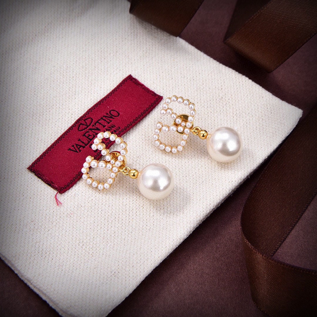 Valentino: We offer FREE SHIPPING for both domestic and international clients who bid over $500. Valentino earrings are making a big splash online! Simple, elegant, stylish, and versatile, these gold stud