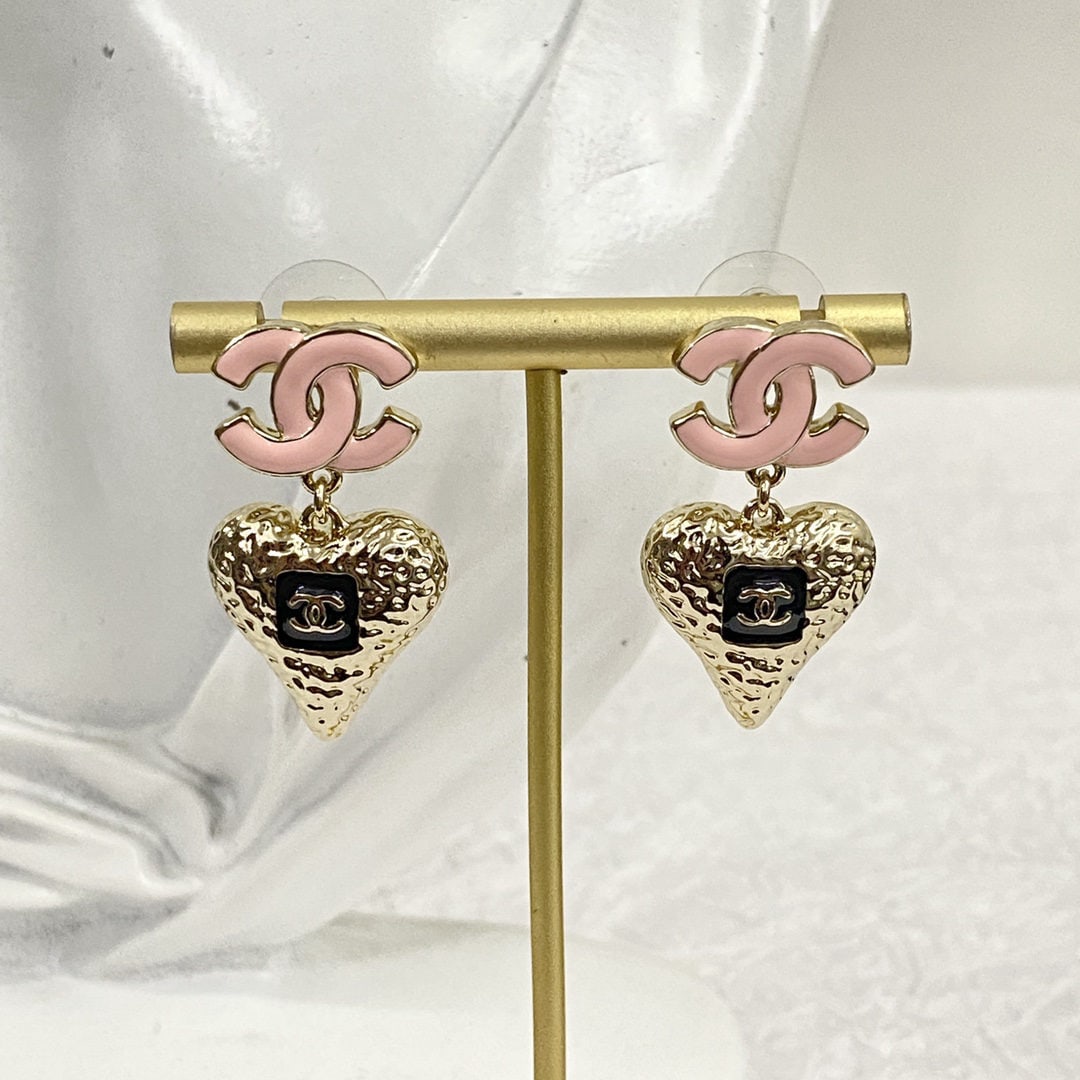Chanel pink enamel double C lava heart earrings: We offer FREE SHIPPING for both domestic and international clients who bid over $500. Chanel pink enamel double C lava heart earrings. The classic black, gold, and pink color scheme is not vintage; th