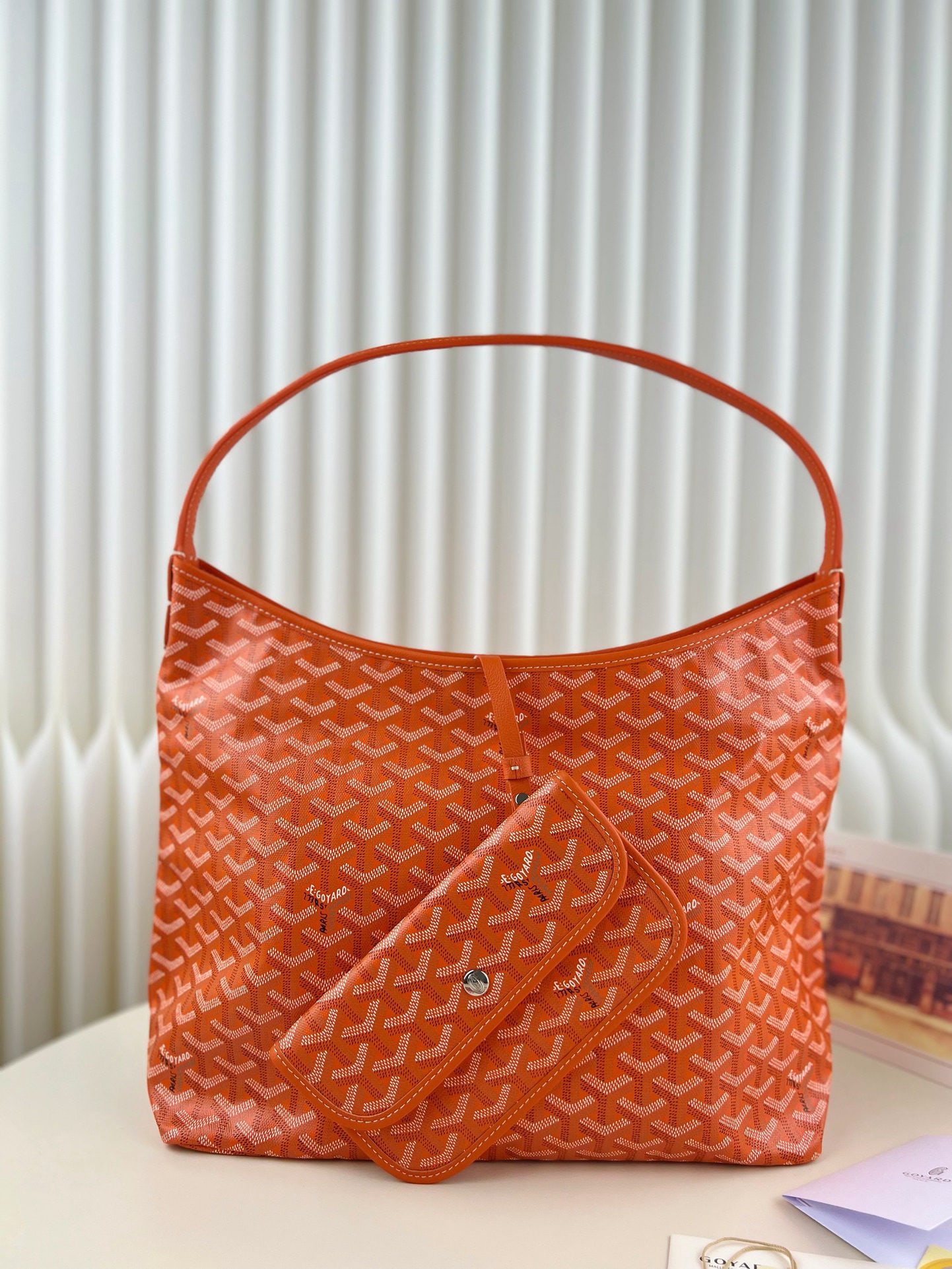 Goyard Boheme Hobo: We offer FREE SHIPPING for both domestic and international clients who bid over $500. The Goyard Boheme Hobo in orange embodies a relaxed and effortless style! Simple, casual, and perfectly suited for