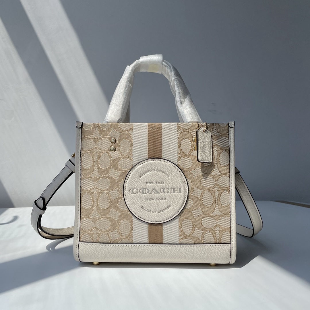 COACH: We offer FREE SHIPPING for both domestic and international clients who bid over $500. COACH classic stripe and COACH appliqu?? DEMPSEY 22 tote bag, fabric and cowhide leather, interior zip pocket and
