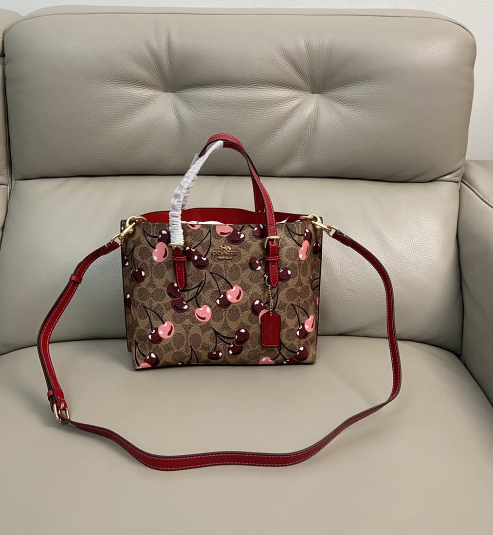 COACH: We offer FREE SHIPPING for both domestic and international clients who bid over $500. COACH's February Teri bag with its adorable cherry print is just too cute! It looks great worn crossbody,