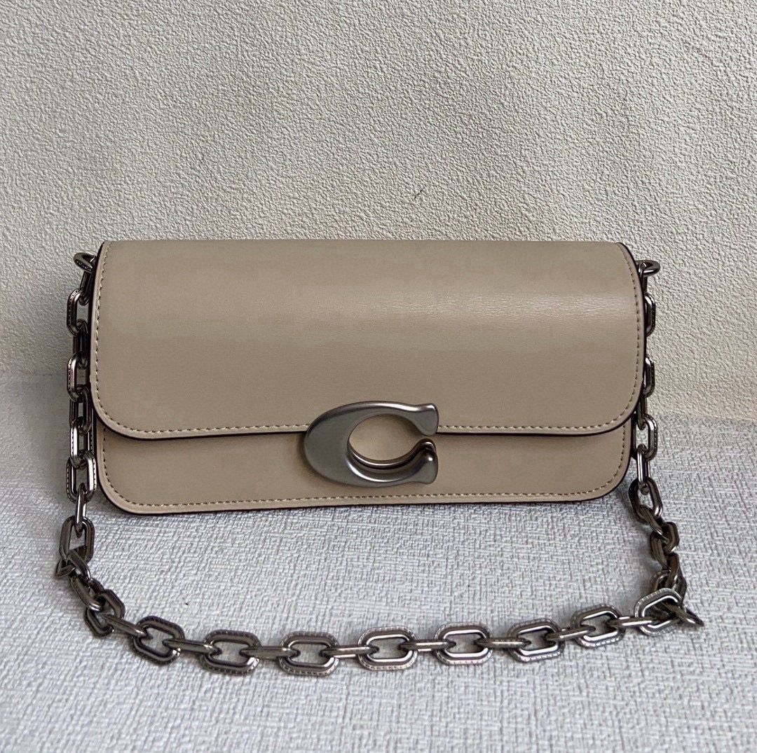 COACH: We offer FREE SHIPPING for both domestic and international clients who bid over $500. The COACH Idol baguette shoulder bag is so beautiful! It can be worn under the arm or crossbody and comes with
