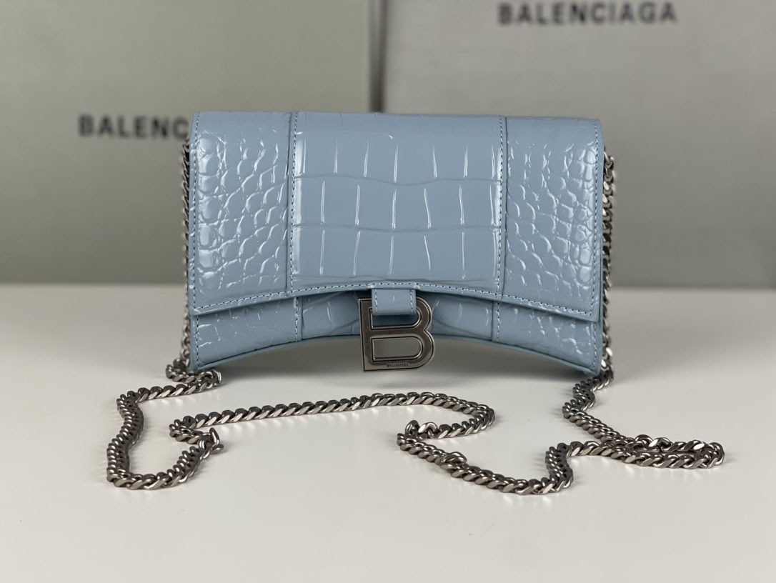 Balenciaga: We offer FREE SHIPPING for both domestic and international clients who bid over $500. This Balenciaga hourglass bag with a chain strap, featuring a crocodile-grey blue color and silver hardware, boast
