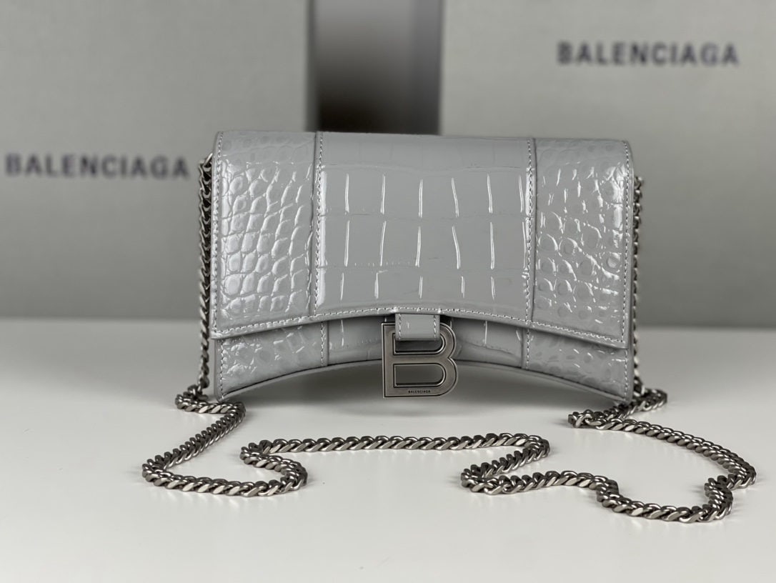 Balenciaga: We offer FREE SHIPPING for both domestic and international clients who bid over $500. This Balenciaga hourglass bag with a crocodile-embossed dark grey design and silver hardware features a unique,
