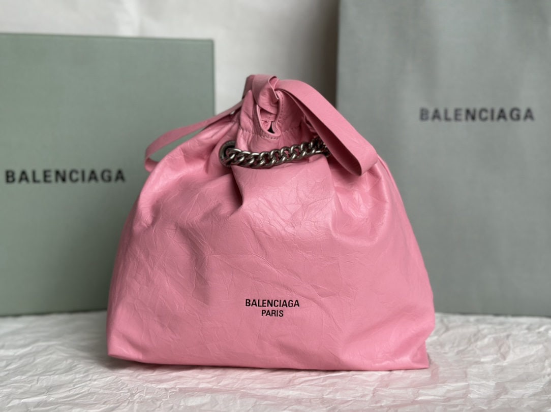 Balenciaga: We offer FREE SHIPPING for both domestic and international clients who bid over $500. This Balenciaga Crush Tote bag in a pleated pink is absolutely gorgeous! Made of glossy, pleated calfskin to mimic