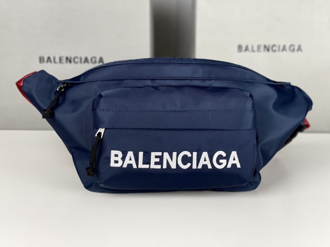 Balenciaga: We offer FREE SHIPPING for both domestic and international clients who bid over $500. Balenciaga canvas embroidered fanny pack in blue. Balenciaga has been incredibly popular these past two years; eve