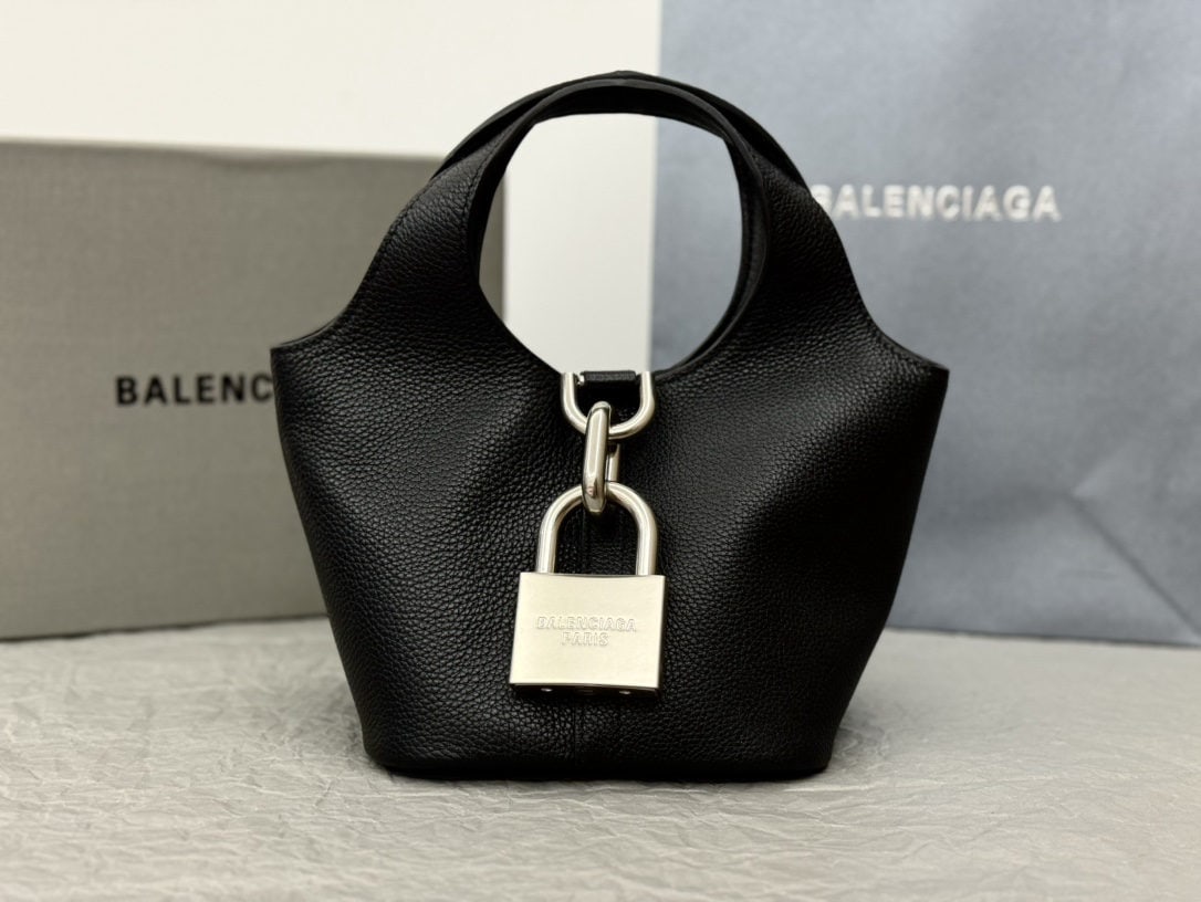 Balenciaga: We offer FREE SHIPPING for both domestic and international clients who bid over $500. Balenciaga Lock Hobo Bag: A Balenciaga lock bag with a bold, free-spirited design. The large lock adds a touch of