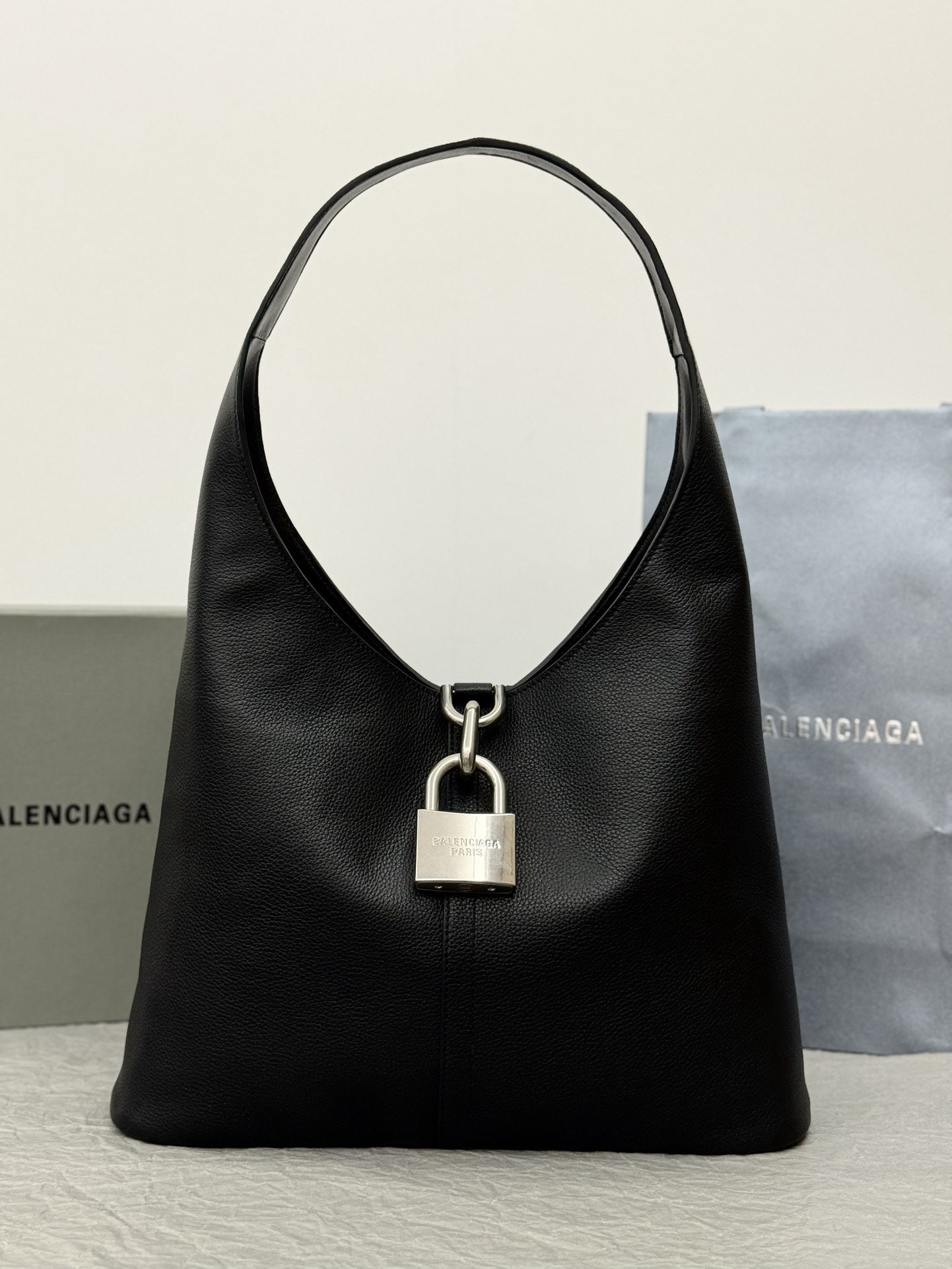 Balenciaga: We offer FREE SHIPPING for both domestic and international clients who bid over $500. Balenciaga Lock Hobo Bag: A Balenciaga lock bag with a bold, free-spirited design. The large lock adds a touch of 