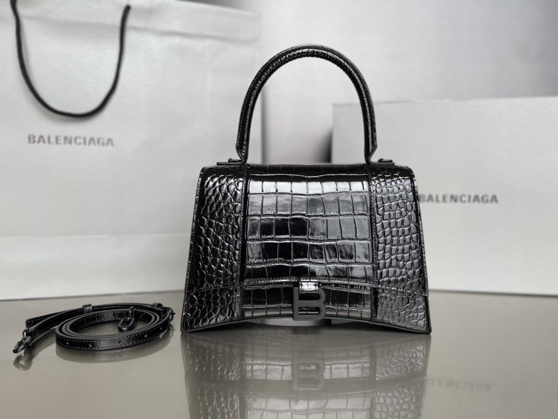 Balenciaga: We offer FREE SHIPPING for both domestic and international clients who bid over $500. The Balenciaga Hourglass bag is crafted from Italian crocodile-patterned cowhide, its clear crocodile texture comp