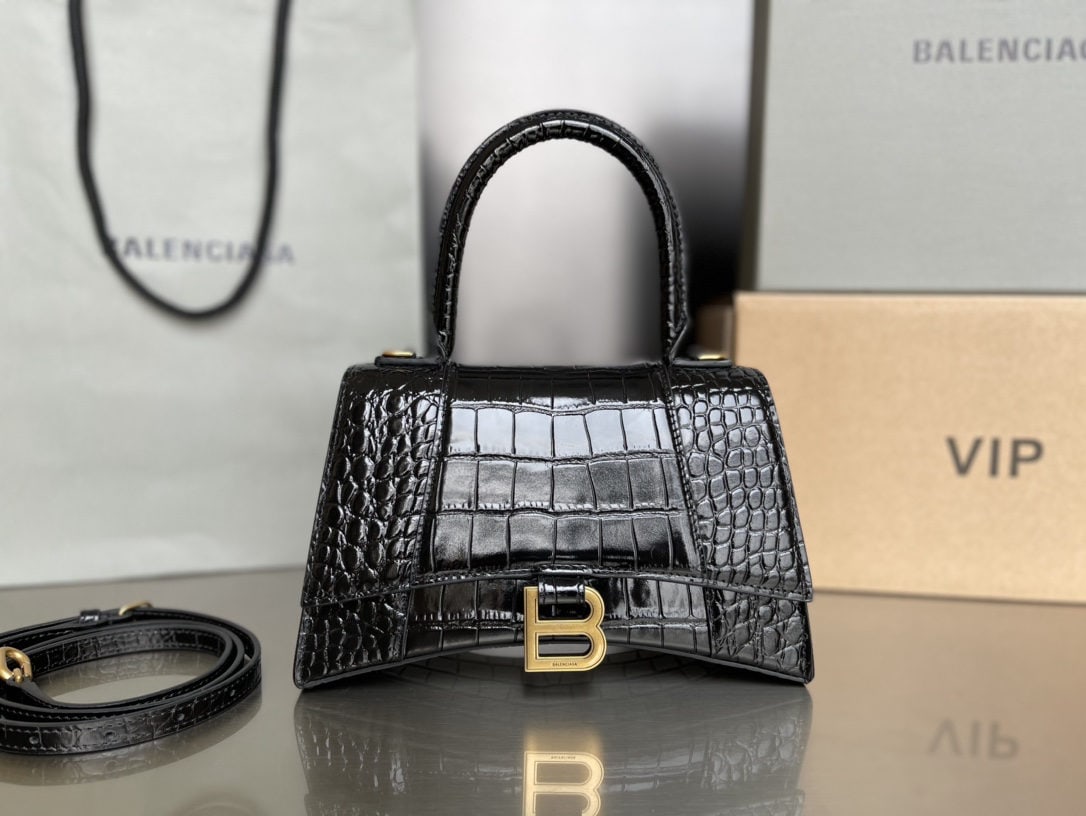 Balenciaga: We offer FREE SHIPPING for both domestic and international clients who bid over $500. The Balenciaga Hourglass bag is crafted from Italian crocodile-patterned cowhide, its clear crocodile texture comp