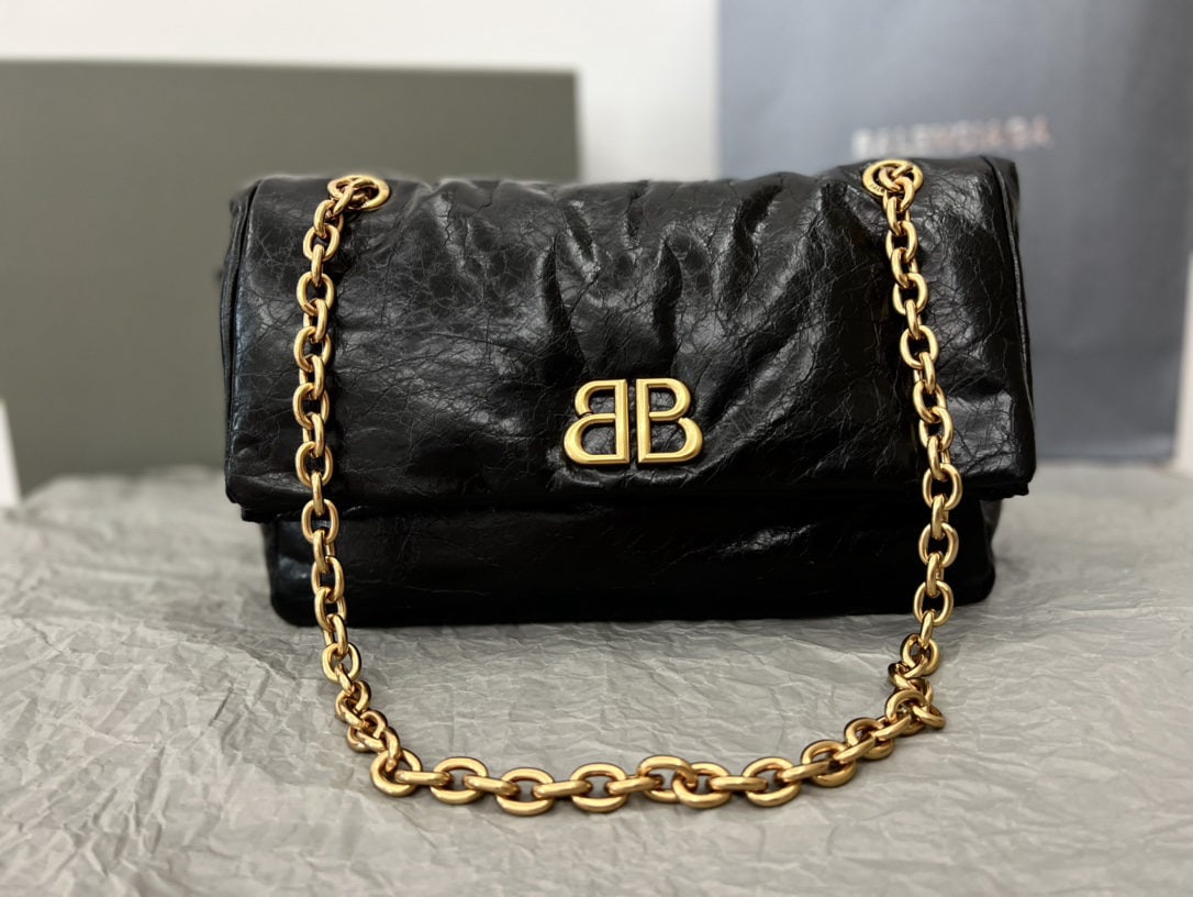 Balenciaga: We offer FREE SHIPPING for both domestic and international clients who bid over $500. The Balenciaga Monaco bag in black and gold with wax coating truly feels incredibly soft and relaxed, like a pillo