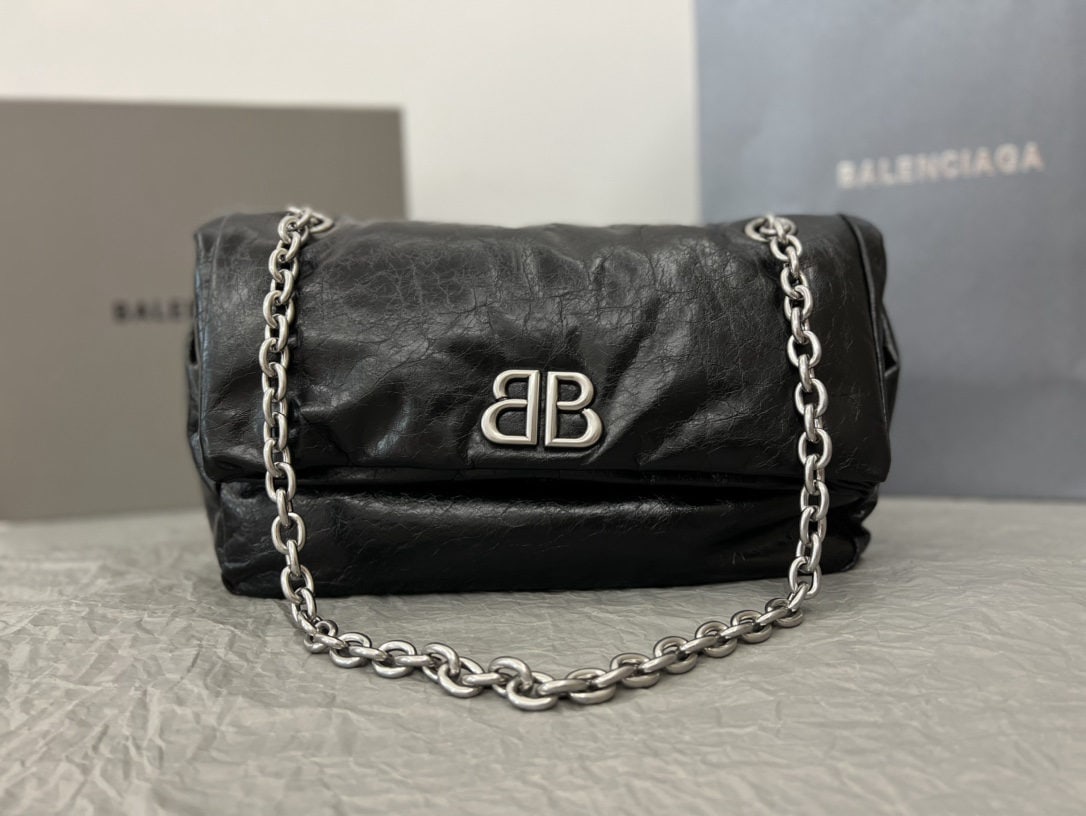 Balenciaga: We offer FREE SHIPPING for both domestic and international clients who bid over $500. The Balenciaga Monaco bag in black and silver with wax coating truly feels incredibly soft and relaxed, like a pil