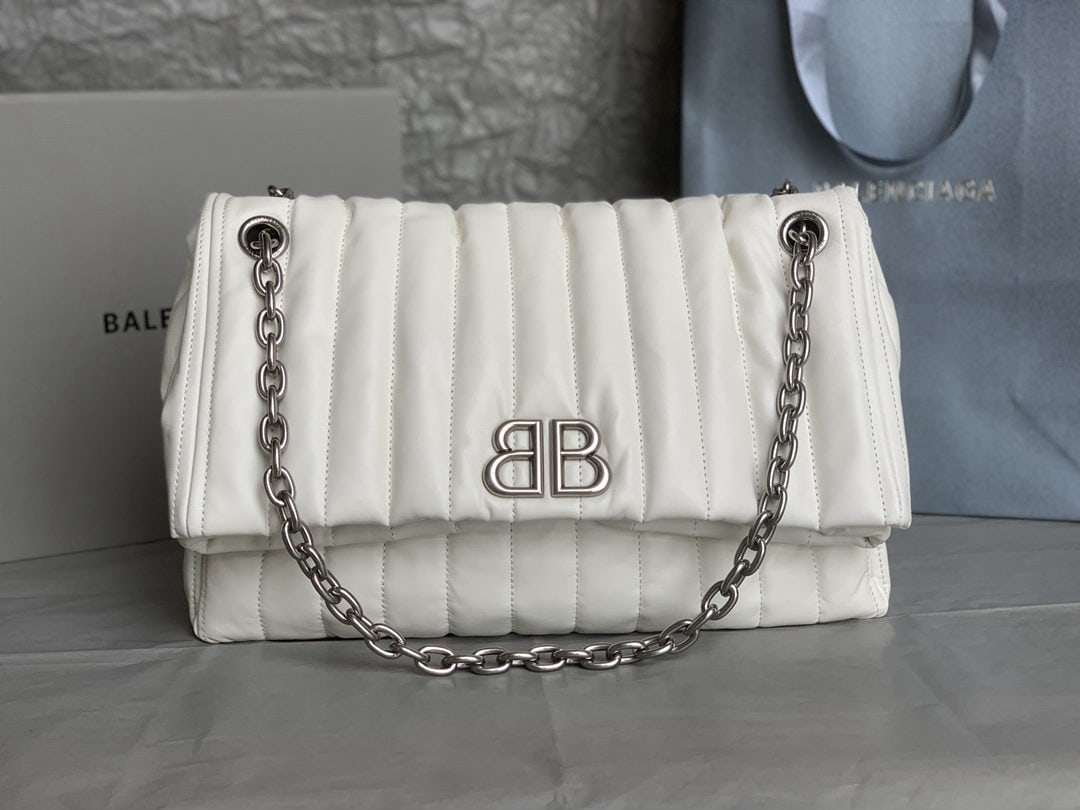 Balenciaga: We offer FREE SHIPPING for both domestic and international clients who bid over $500. The Balenciaga Monaco bag, crafted in silver with embroidered stitching, is incredibly soft and gives a relaxed, p