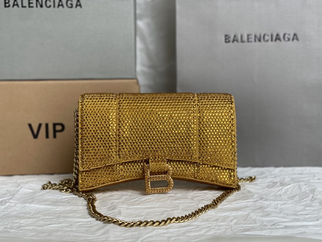 Balenciaga: We offer FREE SHIPPING for both domestic and international clients who bid over $500. The Balenciaga Hourglass bag with its full diamond detail is irresistible to any girl. It's perfect for a night ou