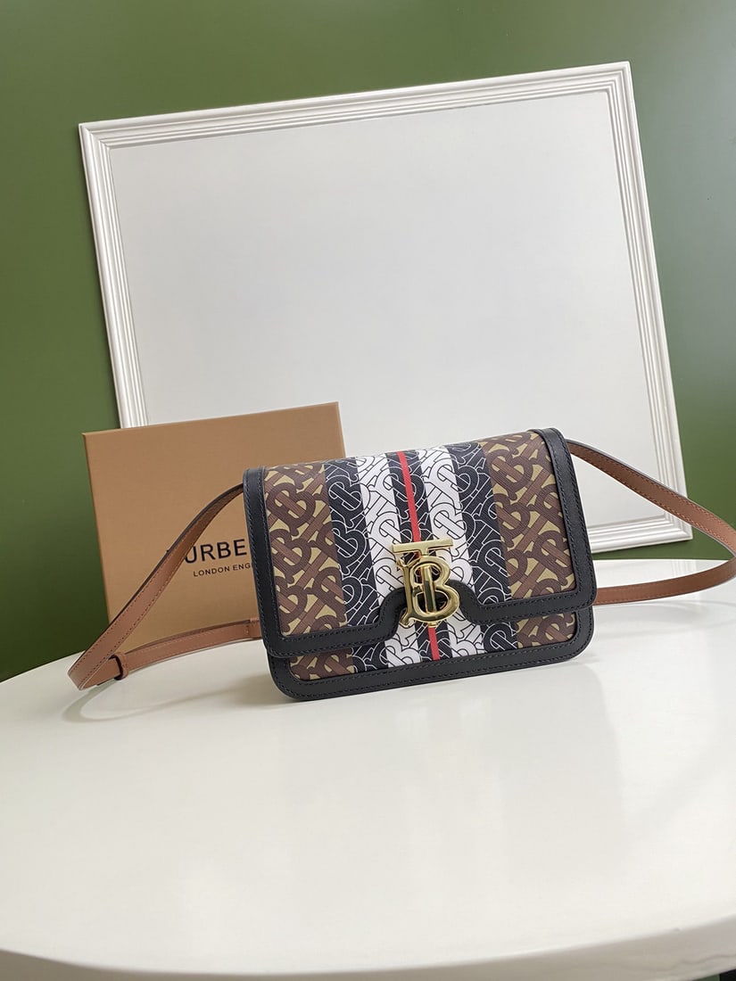 Burberry: We offer FREE SHIPPING for both domestic and international clients who bid over $500. This structured Burberry TB-logo lock bag is crafted from the brand's new eco-friendly canvas. Made primarily from