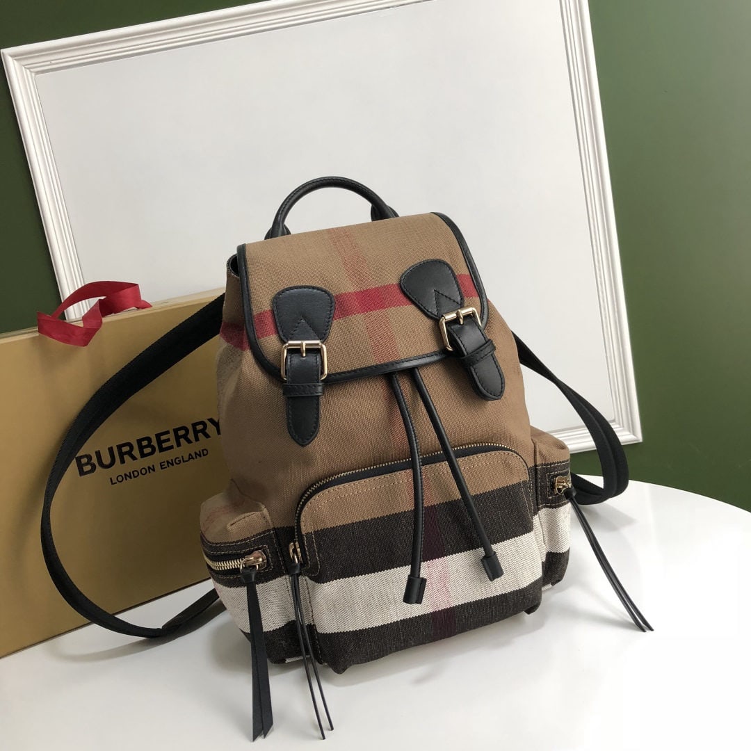 Burberry The Rucksack: We offer FREE SHIPPING for both domestic and international clients who bid over $500. The Burberry The Rucksack is a lightweight military-style backpack in a Canvas pattern, featuring comfortable padd
