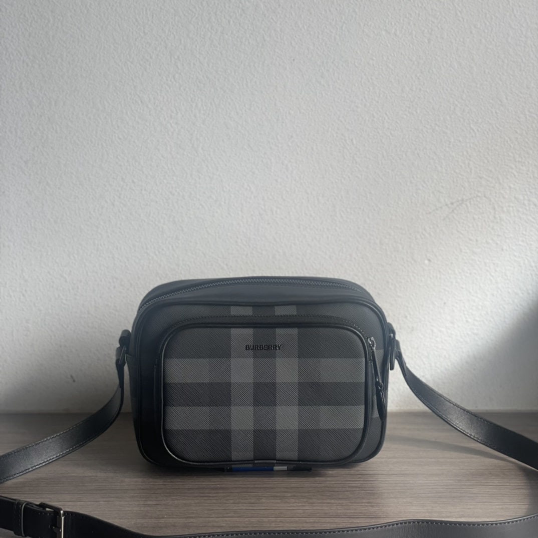 Burberry: We offer FREE SHIPPING for both domestic and international clients who bid over $500. This exquisite Burberry crossbody bag features the brand's oversized check pattern and logo design, and includes a