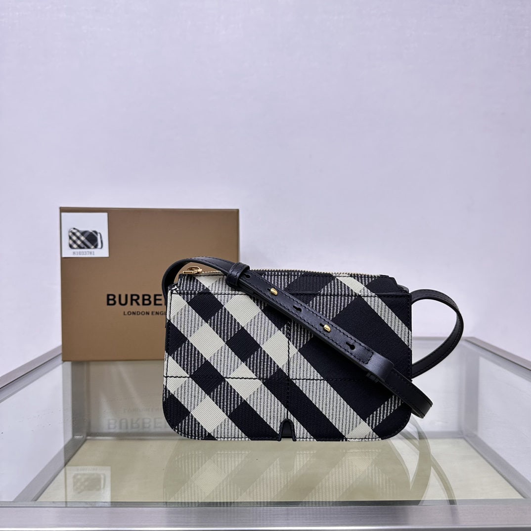 Burberry: We offer FREE SHIPPING for both domestic and international clients who bid over $500. This Burberry zip-up crossbody bag is crafted from a protective cotton blend. The decorative fine-spun Burberry ch