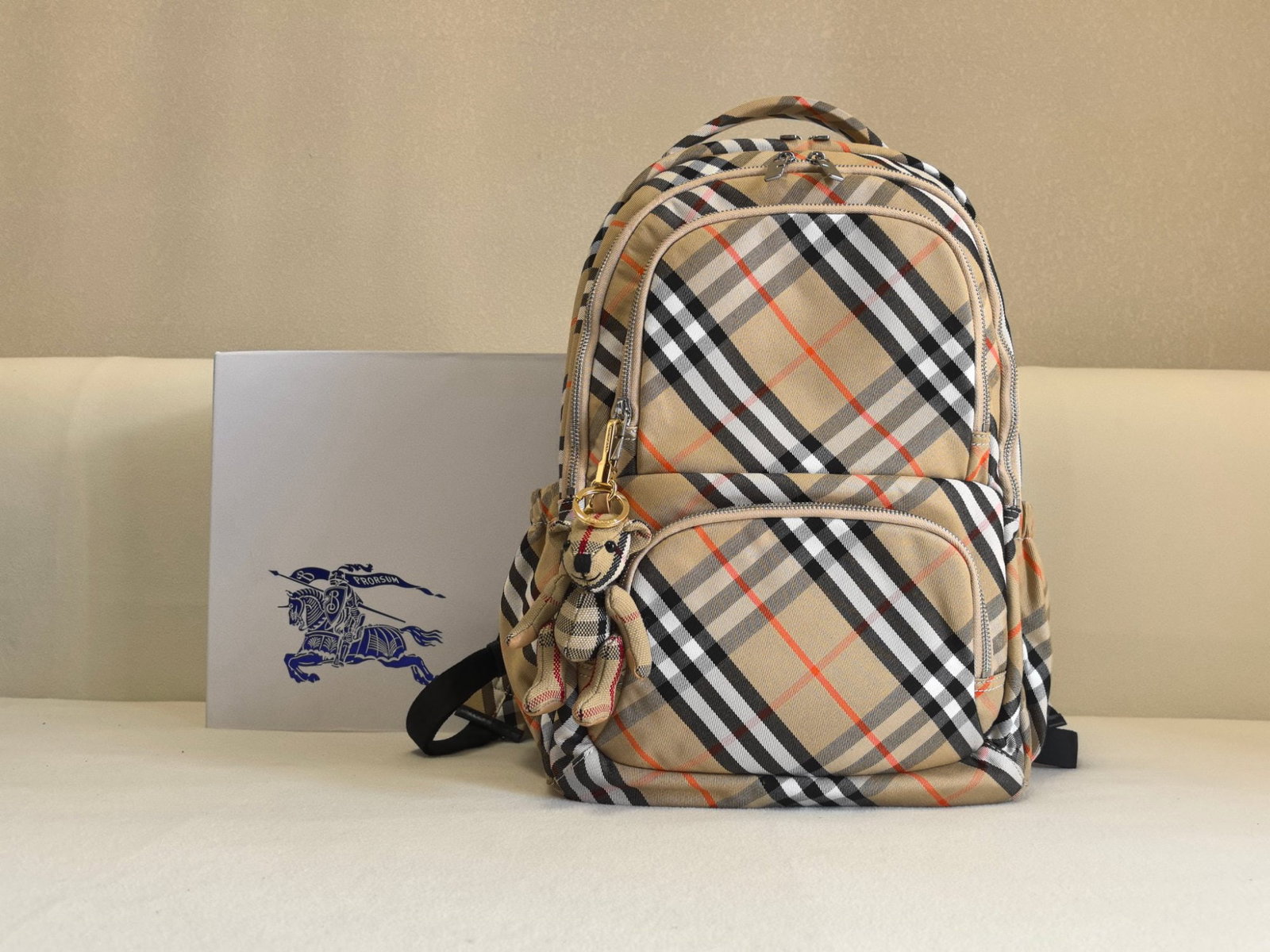 Burberry: We offer FREE SHIPPING for both domestic and international clients who bid over $500. This multi-compartment checkered military backpack is here! It features a B-shaped zipper pull, a side drawstring 
