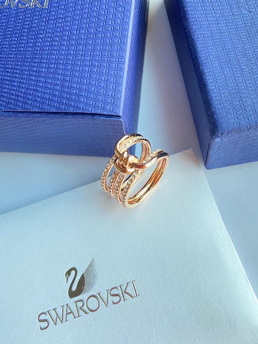 Swarovski knotted ring: We offer FREE SHIPPING for both domestic and international clients who bid over $500. The Swarovski knotted ring, crafted with micro-pave detailing, symbolizes the unique connection between two
