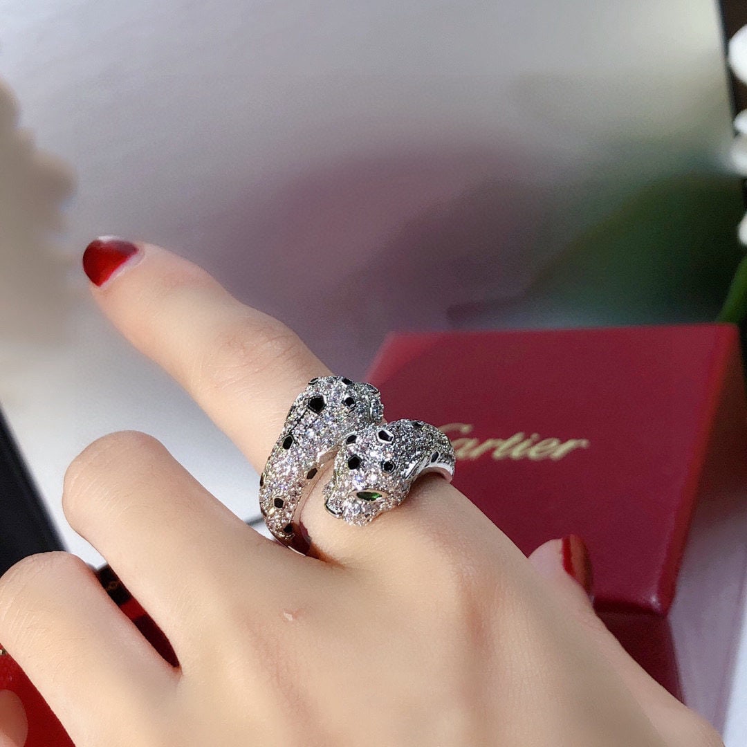 Cartier: We offer FREE SHIPPING for both domestic and international clients who bid over $500. Leopard Ring, a bold double-leopard head ring with full diamonds, from the brand Anthere de Cartier. Leopard brace