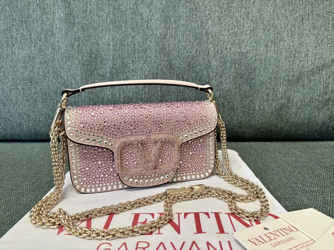 Valentino VLogo Signature: We offer FREE SHIPPING for both domestic and international clients who bid over $500. The Valentino oco handbag from the Diamond Collection features Swarovski crystals adorning its trim and V Logo Sig