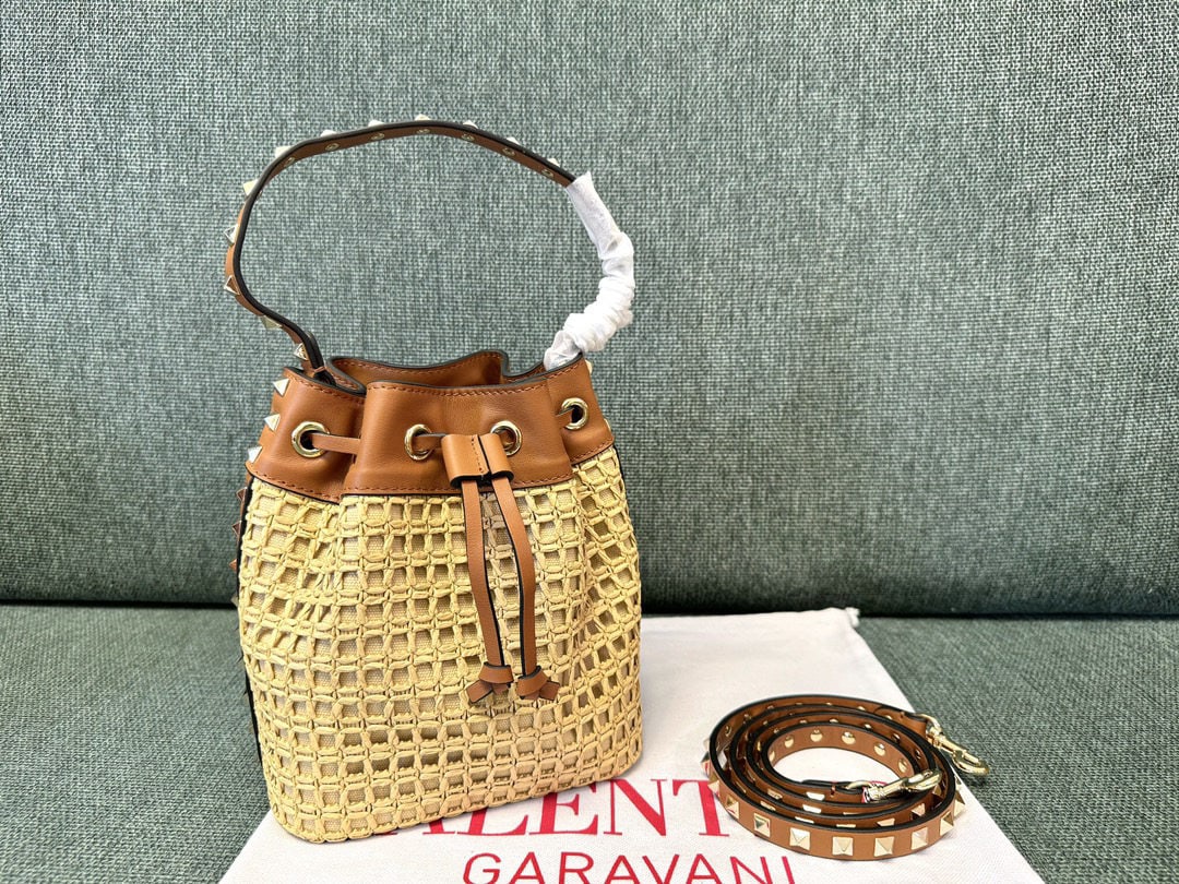 Valentino: We offer FREE SHIPPING for both domestic and international clients who bid over $500. Raffia Bucket Bag, Valentino woven bucket bag. Simple design with one shoulder strap and one interior slip pocket.