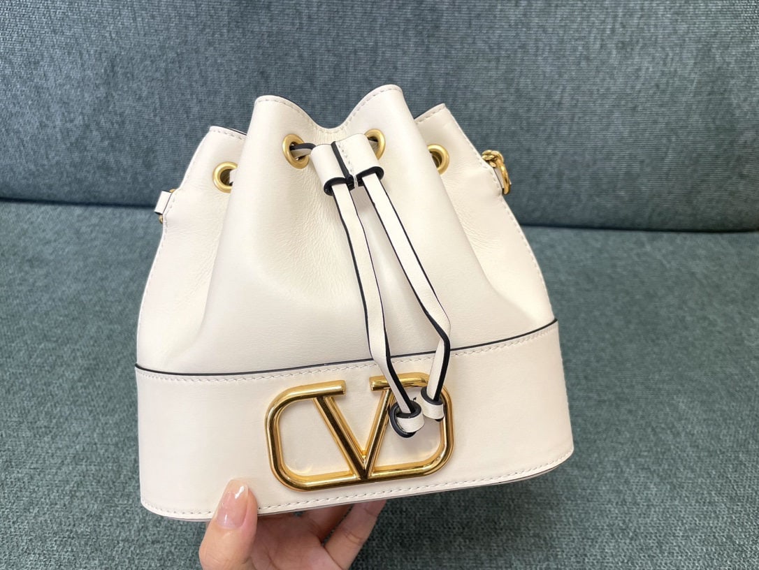 Valentino: We offer FREE SHIPPING for both domestic and international clients who bid over $500. Valentino Mini Bucket Bag - Valentino Mini Lambskin Bucket Bag - Vintage Brass Antique Finish Logo and Hardware - 