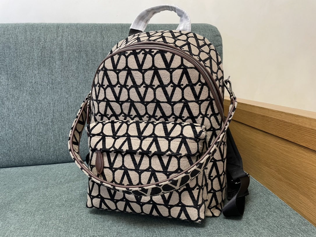 Valentino: We offer FREE SHIPPING for both domestic and international clients who bid over $500. Valentino unisex V-logo backpack with ruthenium-plated hardware - double side zip closures - front zip pocket - on