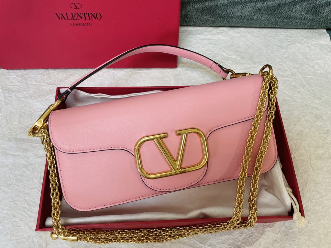 Valentino VLogoSignacar: We offer FREE SHIPPING for both domestic and international clients who bid over $500. Valentino calfskin handbag with metal V-logo Signacar trim - features detachable handles and a detachable sliding 