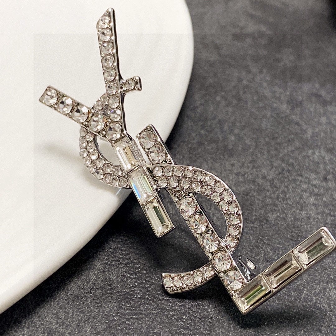 Saint Laurant Silver Full Diamond Brooch: We offer FREE SHIPPING for both domestic and international clients who bid over $500. Saint Laurent's silver diamond-encrusted brooch is the most understanding accessory for women. Women who have pour