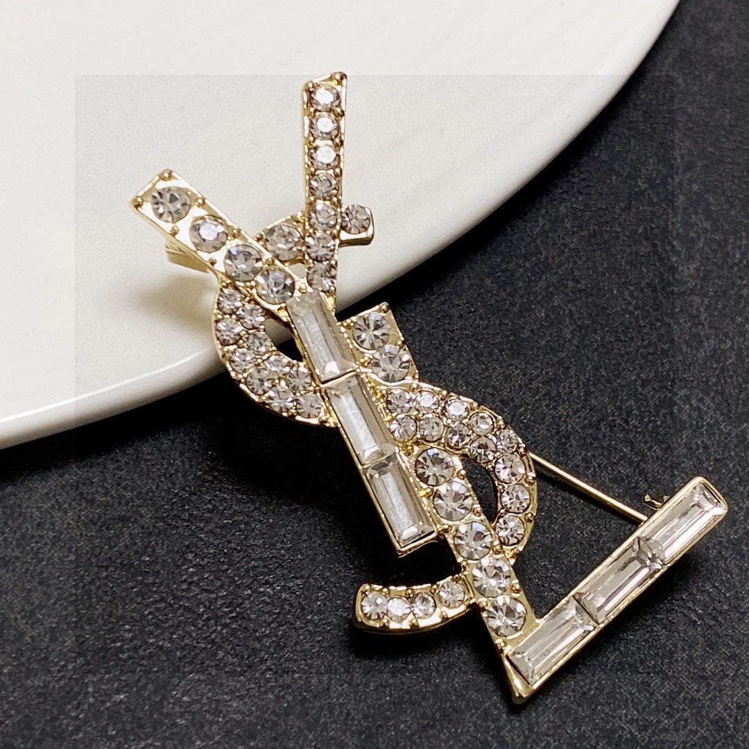 Saint Laurant Silver Full Diamond Brooch: We offer FREE SHIPPING for both domestic and international clients who bid over $500. Saint Laurent's silver diamond-encrusted brooch is the most understanding accessory for women. Women who have pour