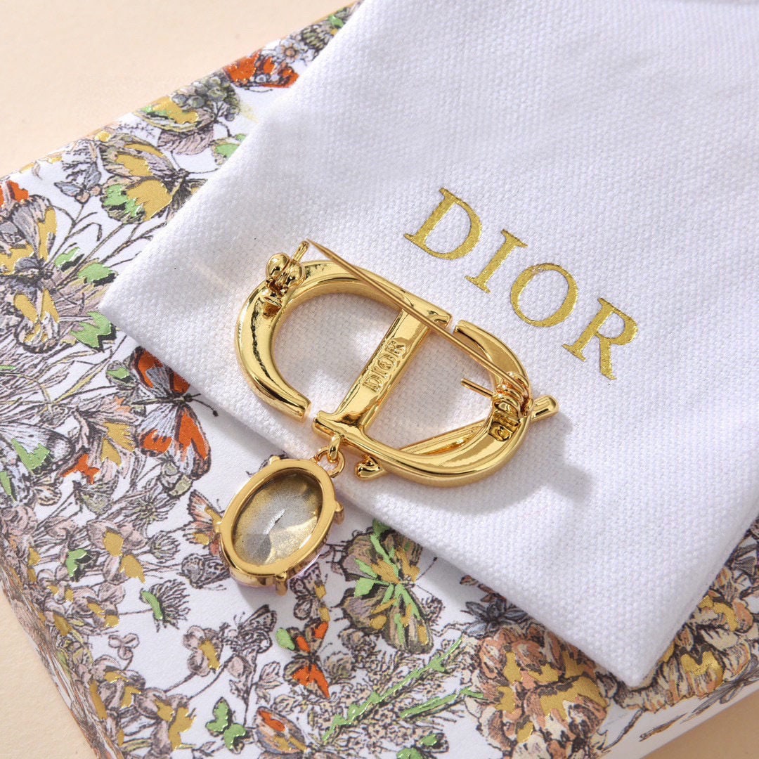 Dior letter brooch: We offer FREE SHIPPING for both domestic and international clients who bid over $500. Dior's metallic letter brooch is a revolutionary statement piece, its trendy letter design making it a must-have
