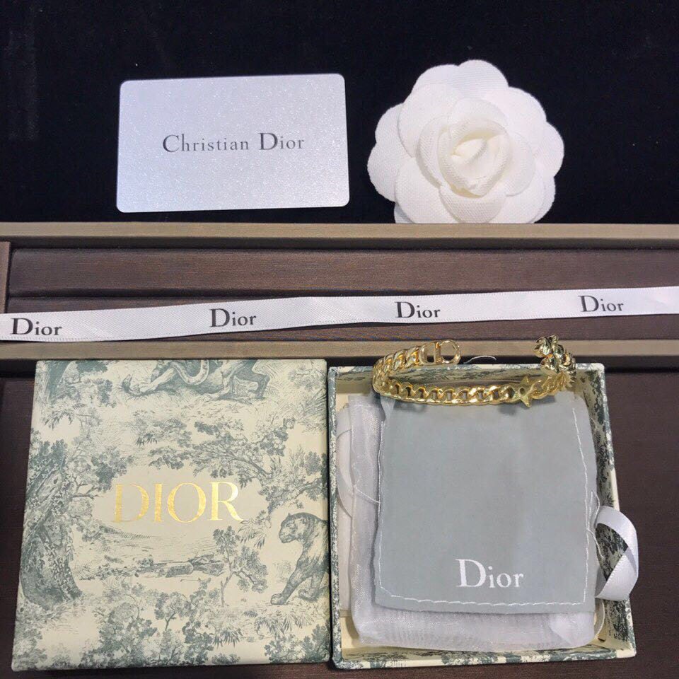 Dior CD logo gold open bangle: We offer FREE SHIPPING for both domestic and international clients who bid over $500. Dior CD logo gold open bangle design, unique retro-avant-garde, a must-have for beautiful women. A wonderful gift 
