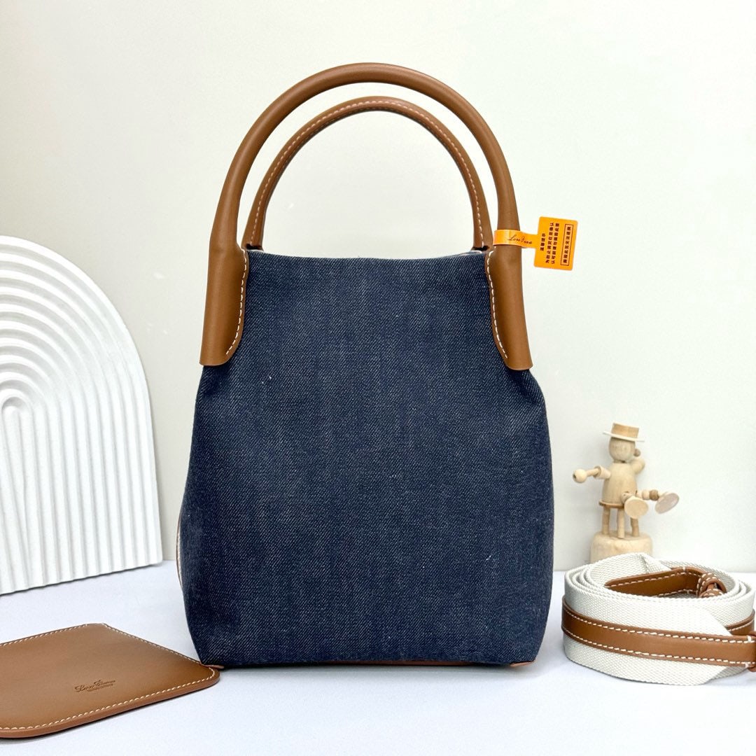 Loro piana Bale Medium Bucket Bag: We offer FREE SHIPPING for both domestic and international clients who bid over $500. The Loro Piana Bale Medium Bucket Bag in blue denim is crafted from signature Flower denim, featuring hand-stitche