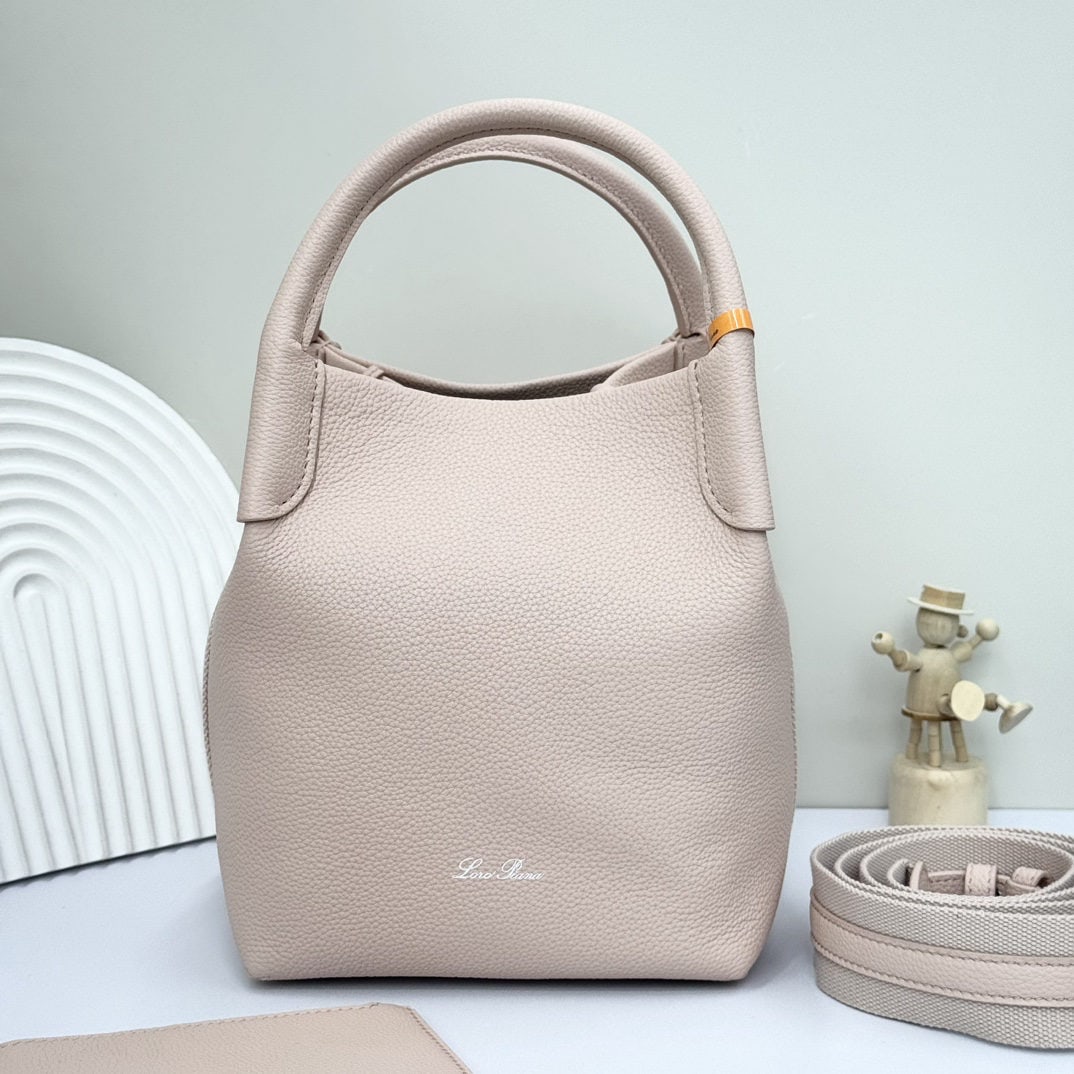 Loro piana Bale Medium Bucket Bag: We offer FREE SHIPPING for both domestic and international clients who bid over $500. The Loro Piana Bale Medium Bucket Bag in Marble Pink is crafted from premium calfskin leather with a suede lining.