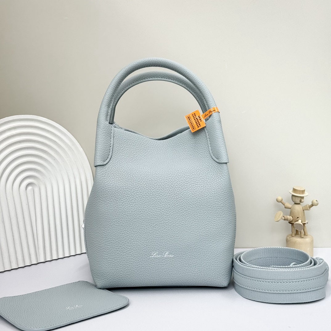 Loro piana Bale Medium Bucket Bag: We offer FREE SHIPPING for both domestic and international clients who bid over $500. The Loro Piana Bale Medium Bucket Bag in Ice Blue is crafted from premium calfskin leather with a suede lining. It