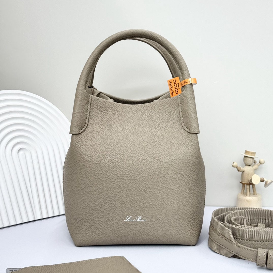 Loro piana Bale Medium Bucket Bag: We offer FREE SHIPPING for both domestic and international clients who bid over $500. The Loro Piana Bale Medium Bucket Bag in a light frankincense color is crafted from premium calfskin leather with 