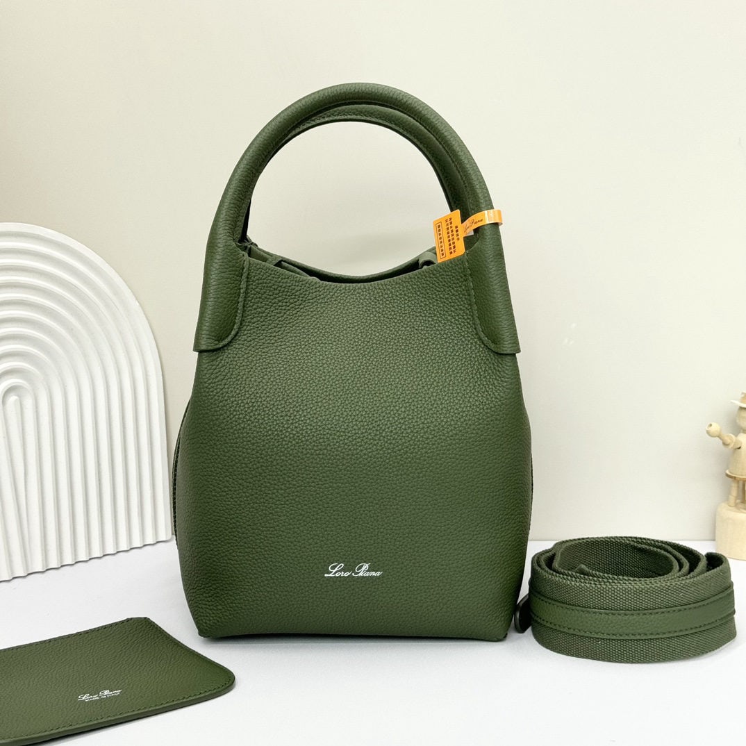 Loro piana Bale Medium Bucket Bag: We offer FREE SHIPPING for both domestic and international clients who bid over $500. The Loro Piana Bale Medium Bucket Bag in Lichen Green is crafted from premium calfskin leather with a suede lining